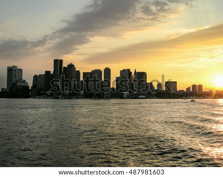 Boston city skyline silhouette background at sunset 