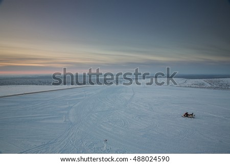 Winter landscape during sunrise near Ivalo, Finland.