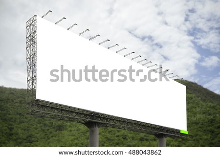 Blank big billboard against green mountain and blue sky background,for your advertising,put your own text here,isolate white on board