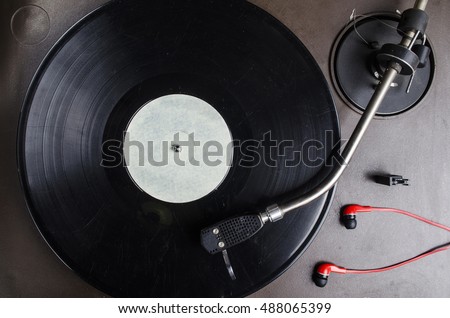 old black vinyl record in the player