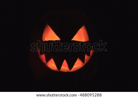 scary pumpkin heads smile in the dark
