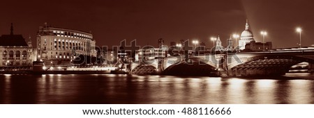 Blackfriars Bridge and St Pauls Cathedral in London at night.