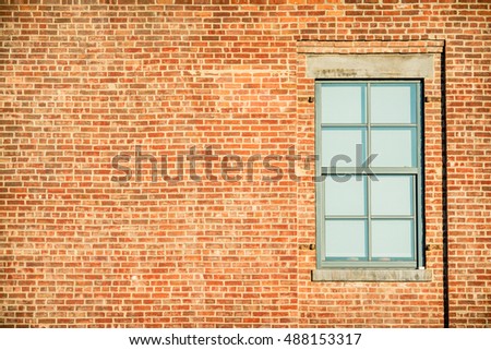 lonely window at brick facade