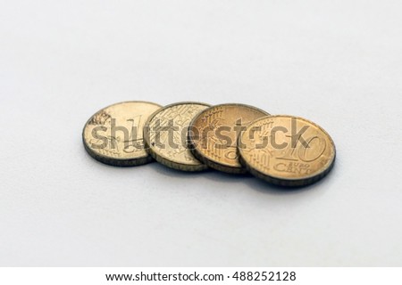 Some various coins on the white background