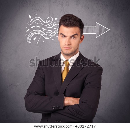 An elegant confident  businessman in suit knows the solution to a problem concept with drawn arrow illustration on urban concrete wall concept