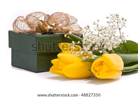 Yellow tulips and gift box on a white background