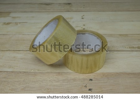 Natural packing scotch tape on wooden and texture background