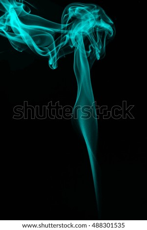 Blue smoke on black background, movement of blue smoke