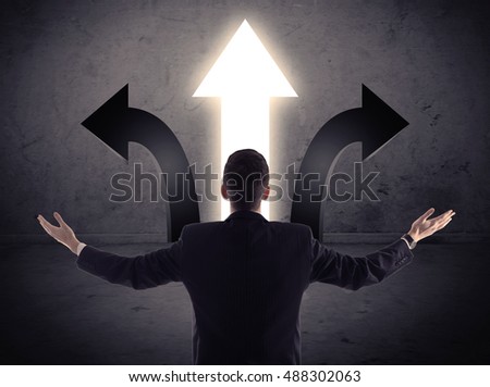 A businessman in doubt, having to choose between three different choices indicated by arrows pointing in opposite direction concept