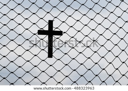 Silhouette Wooden cross on Nets hung.
