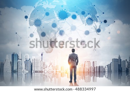 Rear view of businessman with hands in pockets looking at large planet in the sky with startup sketch. Toned image. Double exposure