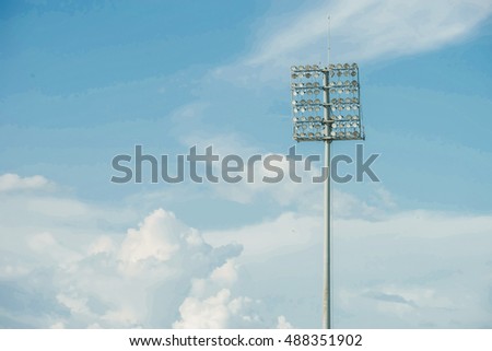 stadium spotlight post in blue sky sunny day