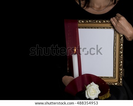 woman outflank blank mourning frame with sympathy flower