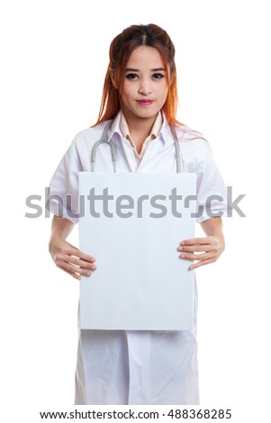 Young Asian female doctor show a blank sign  isolated on white background.