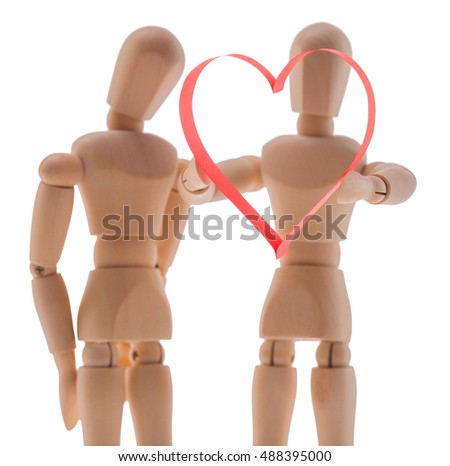 two wooden figure dummy mannequin, give romantic gift a big red heart, isolated on a white background - pictures concept theme Love and St. Valentine's Day. synonymous expression - I give you my heart