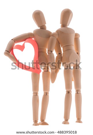 two wooden figure dummy mannequin, give romantic gift a big red heart, isolated on a white background - pictures concept theme Love and St. Valentine's Day. synonymous expression - I give you my heart