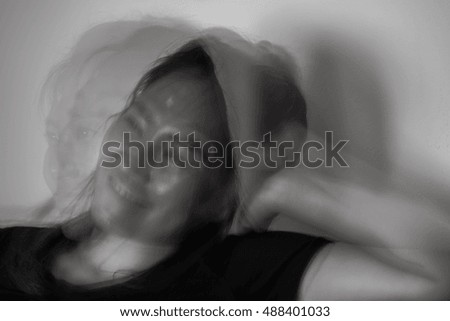  Motion blur image of happy girl watching television 