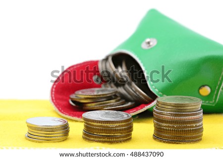 Stack of coins on a yellow cloth