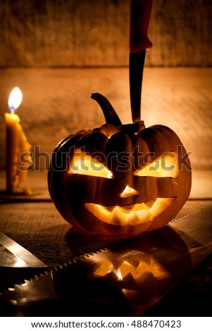 Halloween pumpkin on wooden background.