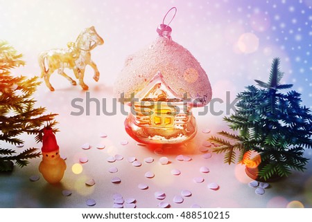 Christmas. New Year scenery. Toys: hut, horse and Christmas tree. New Year’s Day