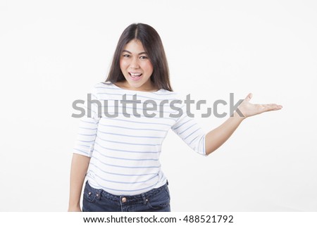 young woman holding something on the palm. Isolated white background