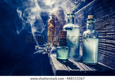 Magical witch lab with blue light and potion for Halloween Royalty-Free Stock Photo #488553367