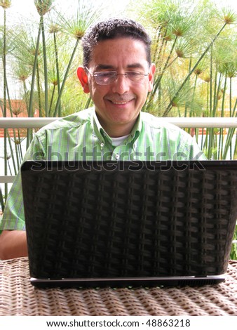 Business man working on laptop with glasses