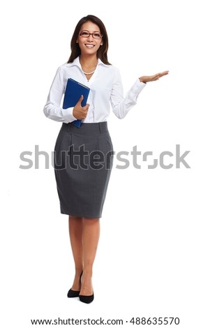 Asian business woman presenting copy space. Royalty-Free Stock Photo #488635570