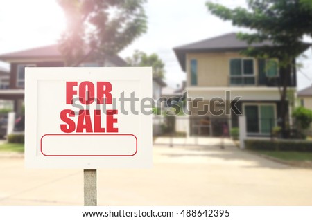 Beautiful business new house real estate sign in front of new house for sale