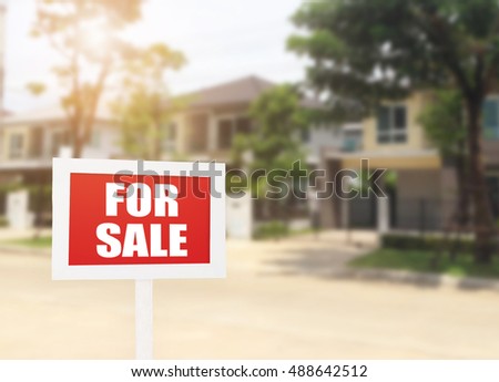 Beautiful business new house real estate sign in front of new house for sale