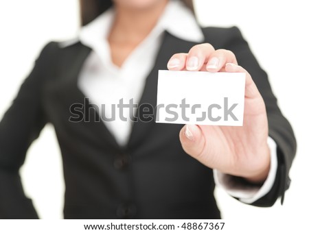 Businesswoman showing and handing a blank business card. Business woman in black suit Isolated on white background.