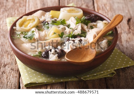 tasty Scottish chicken soup with leeks and prunes close up in a bowl on the table. horizontal
 Royalty-Free Stock Photo #488679571