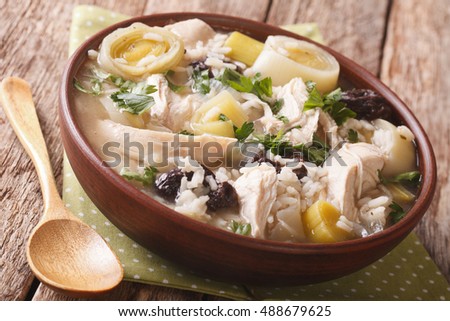 Scottish cock-a-leekie soup with leeks and prunes close up in a bowl on the table. horizontal
 Royalty-Free Stock Photo #488679625