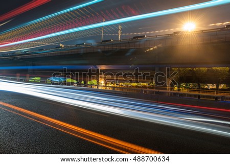 traffic light trails on urban street in city of China.