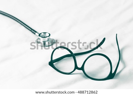Eyeglasses and medical stethoscope
