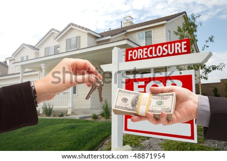 Handing Over Cash For House Keys in Front of House and Foreclosure Sign
