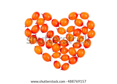 Heart fresh juicy sea-buckthorn on a white background in isolation. Horizontal photo. Royalty-Free Stock Photo #488769157