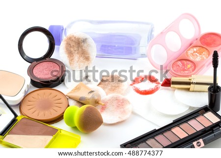 makeup brushes in holder and cosmetics isolated on white / cosmetics set for make-up