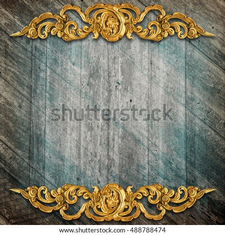 Pattern of gold Stucco flower on wood background