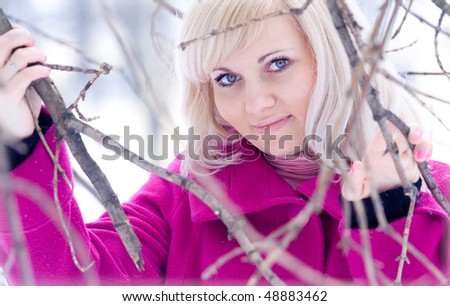 Outdoor portrait of a beautiful girl in winter