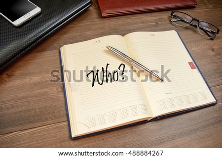 Title who and business accessories on desktop: notebook, diary, fountain pen, mobile phone, glasses.
