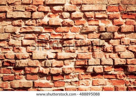 Destroyed brick wall texture. Old red and dirty brick grunge texture.