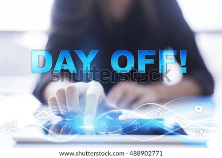 Woman is using modern tablet pc, presssing on touch screen and selecting "Day off!".