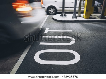 OUT Signage Parking Lot Gate Car moving Building outdoor 