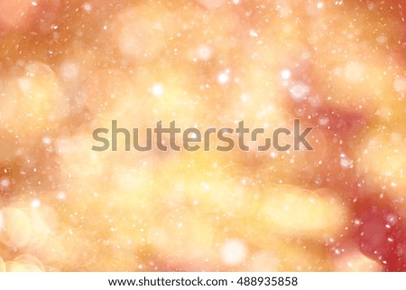 orange bokeh blurred background snowflakes glare