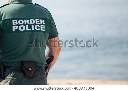 Closeup of a border police officer Royalty-Free Stock Photo #488973004