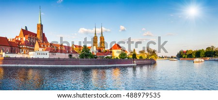 Picturesque scene of famous Tumski island with cathedral of St. John on Odra river. Colorful spring landscape in Wroclaw, Poland, Europe. Artistic style post processed photo.
