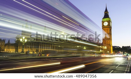 Long exposure picture of the Big Ben and Westminster in London at night with bus and traffic light trails