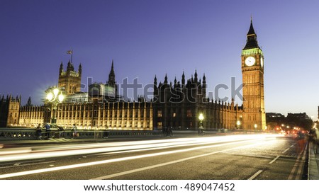Long exposure picture of the Big Ben and Westminster in London at night with traffic light trails