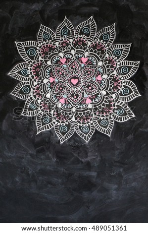 mandala pattern on a real chalkboard background